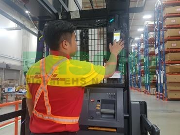 DHL Singapore -Employee completing a safety and fatigue checklist at the beginning of a shift.