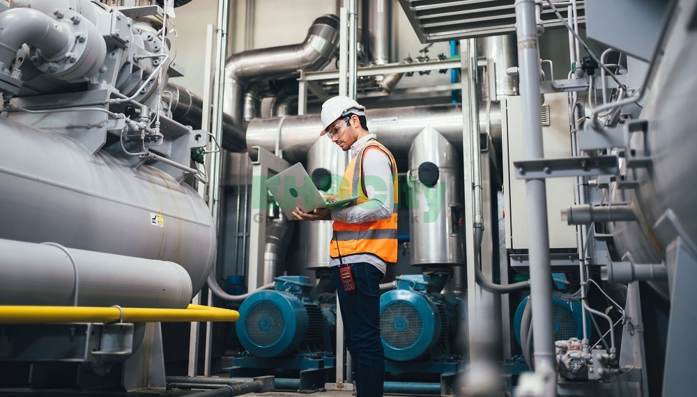 professional-worker-in-factory-using-laptop